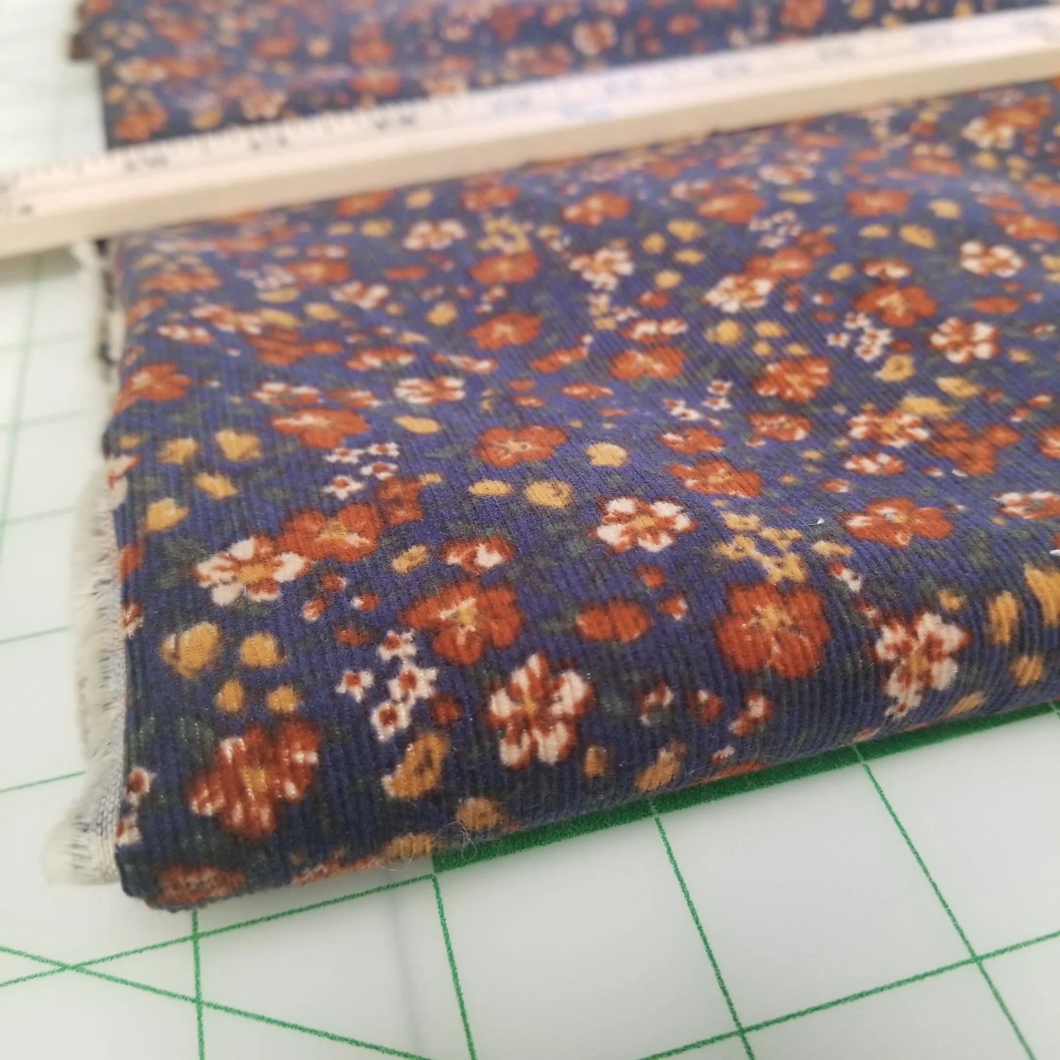 End of BOlt: 2 yards of 100% Cotton Baby Wale Corduroy Indigo Blue and Orange Floral  Woven